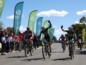 Cannondale-Blend's Waylon Woolcock (centre) and Darren Lill (right) savour the victory on day three of the nine-day Old Mutual joBerg2c at Sterkfontein Dam in the Free State on Sunday. Photo: Alistair Schorn