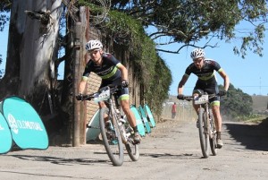 Cannondale-Blend's Darren Lill (left) and Waylon Woolcock take their fourth stage win and the overall lead on day eight of the nine-day Old Mutual joBerg2c mountain bike race in Highflats, KwaZulu-Natal, on Friday. Photo: Full Stop Communications