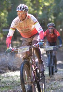 Mountain bikers Nico Pfitzenmaier (left) and Renay Groustra power through the Fisantehoek forest en route to victory in the first stage of the RECM Knysna 200 on Friday. Photo: Full Stop Communications