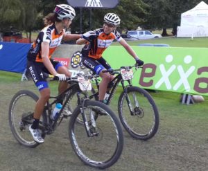 Overnight leaders Ariane Kleinhans and Annika Langvad congratulate each other at the end of stage two of the 2015 Absa Cape Epic at Oak Valley. Photo: Full Stop Communications