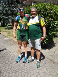 Goldy Fuchs with national team coach Elrick Kulsen after winning the silver medal in the T2 Men's Time Trial event at the 2015 UCI Para-cycling Road World Cup, Elzach, Germany from 24-26 July. 
