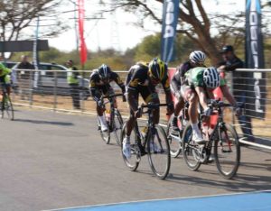 Ryan Gibbons (right) edges out runner-up Meron Teshome (left) and third-placed Nolan Hoffman (obscured) to take the win in the Powerade Lost City Cycle Classic, presented by Bestmed, at Sun City on Saturday. Photo: Rika Joubert/Cycle Nation