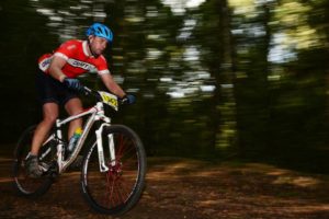 Morne van der Westhuizen pinning it down a forest singletrack. Photo by: Julie Anne Hoffman