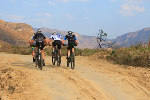 Teams working together up the iconic Sani Pass on day two of the Dragon are not an uncommon sight as riders tackle the 17km journey to the top. Photo: Greg Labuschagne Photography