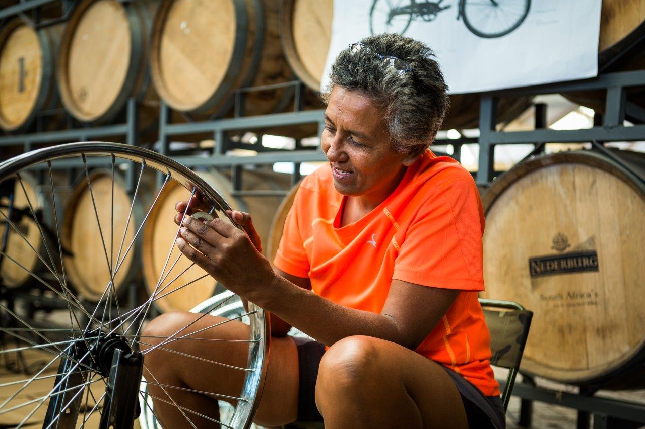 Beverly Roode working on a bicycle