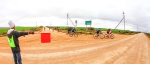 A marshall shows riders where to go during the Around The Pot Overberg 100 Miler.