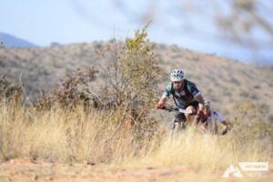 Riders crest a climb