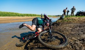 Slipping and sliding on a muddy section of the iMfolozi MTB Challenge route.