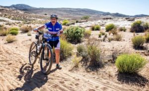 An image of a rider taking a break during the first day of the Namaqua Quest MTB Stage Race.