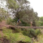 A mountain biker crossing a bridge during last year's Swazi 3 Reserves.