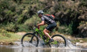 Riders had to cross a river on day five of the Lesotho Sky.