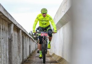 A rider makes his way along a narrow bridge during the third stage of the Cape Pioneer Trek.