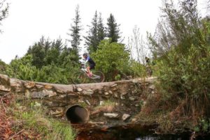 Riders makes their way along a low lying rustic stone bridge during the third day of the Cape Pioneer Trek, which took place in and around George.