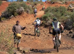 Riders passing an onlooker