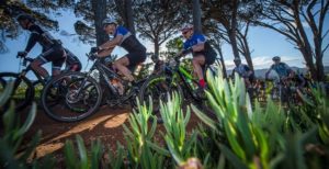 A bunch of riders in action shortly after the start of the first Wines2Whales Adventure stage.
