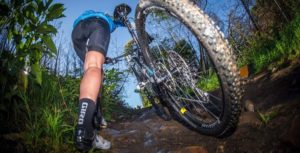 A rider gets off the saddle to push his bike up a section of a climb on day one of the Wines2Whales Adventure. Photo: Tobias Ginsberg