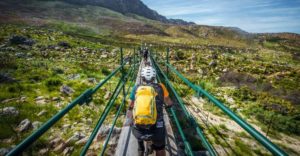 A rider crosses a bridge during day one of the Wines2Whales Ride.