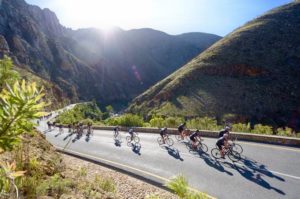 An image of cyclists passing through a beautiful scenic part of the Double Century route.
