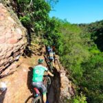 Riders make their way through a narrow section of the Trailseeker route.