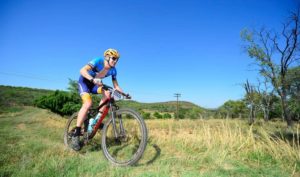 A mountain biker enjoyed some beautiful green pastures along the Trailseeker route.