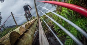 A mountain biker crosses a bridge on day one of the Wines2Whales Race.