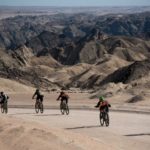 Riders scattering about with a magnificent mountainous backdrop. Photo: Gondwana Collection Namibia