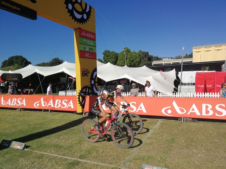 Investec-Songo-Specialized’s Annika Langvad and Kate Courtney pictured crossing the finish line in the stage five time-trial of the Cape Epic in Wellington today. Photo: Cape Epic