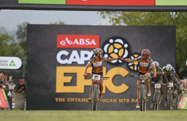 Investec-Songo-Specialized's Annika Langvad and Kate Courtney pictured fist pumping each other while winning stage six of the Cape Epic today. Photo: Zoon Cronje/Cape Epic