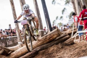 Swiss Sina Frei pictured flying through the air on the 'pick-up-sticks' in the under-23 women's race at the UCI Mountain Bike World Cup in Stellenbosch. Photo: Shannon Valstar