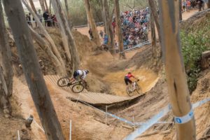 Sam Gaze (front) and Nino Schurter pictured going down the wine barrel in the men's elite race at the UCI Mountain Bike World Cup in Stellenbosch. Photo: Shannon Valstar