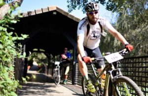 Rider taking on a bridge during the Cradle Traverse third stage yesterday. Photo: Sage Lee Voges/ZC Marketing Consulting