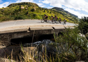 Double90 Team Challenge cyclists cross a bridge