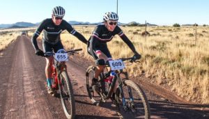 Rider pushing his teammate on the final Trek 2 Teebus stage