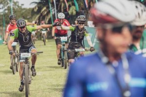 Riders hi-fiving each other after completing the nine-day Joberg2c. Photo: Kevin Sawyer