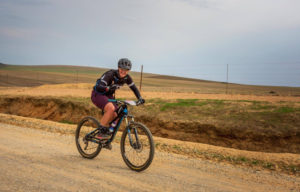 Female mountain biker on route Amarider 100Miler