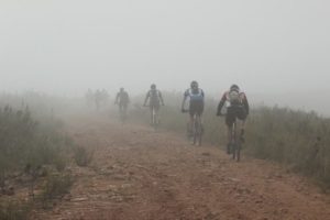 Riders taking on a heavily-misted flat track during stage two of the Great Zuurberg Trek. Photo: Shayne Minott