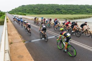 A bunch of riders pass the elite riders during this year's Tour Durban