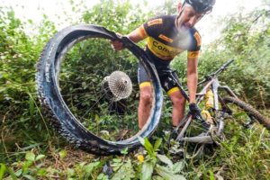 Rider fixing a mechanical during the sani2c Race. Photo: Anthony Grote
