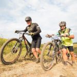 Riders pushing their bikes up a steep climb during the sani2c Race. Photo: Anthony Grote