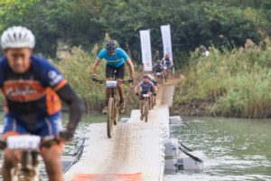 Riders crossing a wavy bridge during the sani2c Race. Photo: Anthony Grote