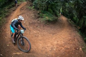 A rider takes a corner on day two of sani2c Adventure