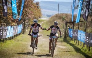 Riders celebrate as they finish day one of sani2c Adventure