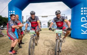 Riders crossing the finish line on day three of sani2c Adventure