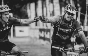 Riders congratulate each other after finishing day three of sani2c Adventure