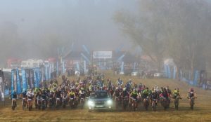 Riders are led out of the start on day one of the sani2c Race