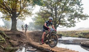 Matthew Beers crosses a wooden bridge on day one of the sani2c Race