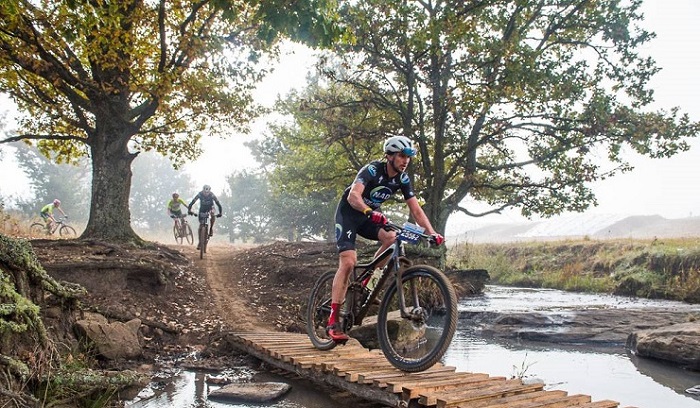 Matthew Beers crosses a wooden bridge on day one of the sani2c Race