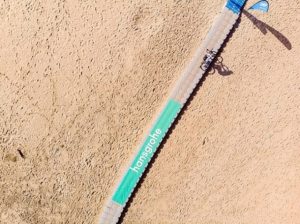 Crossing a bridge over beach sand on the final day of the sani2c Trail.