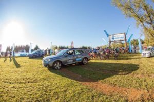 A vehicle leads the riders out at the start of day one of sani2c Trail