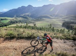 A tired rider pushing his bike up a climb with a great view during stage two of the Greyt Escape. Photo: Oakpics.com